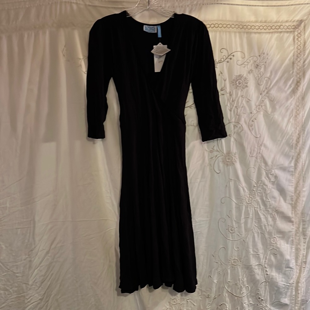 Gorgeous black dress by survival ties in back brand new with tags